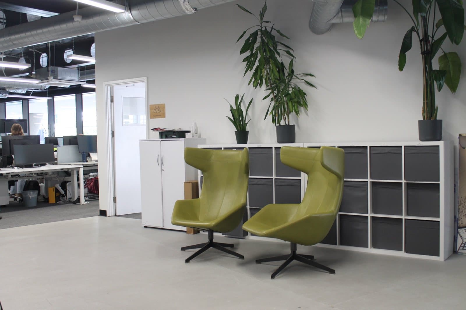 Reclaimed lounge chairs and storage in the Overbury site office