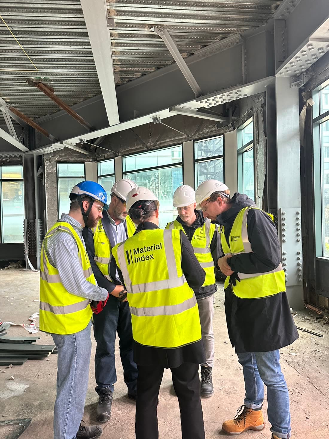 Material Index and Skanska teams in hi-vis reviewing the audit app on site at British Land's 1 Appold Street