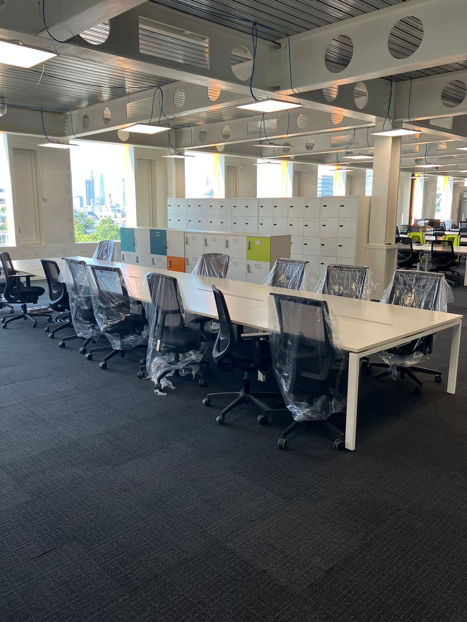 Reclaimed desks and chairs in place on an Overbury site setup