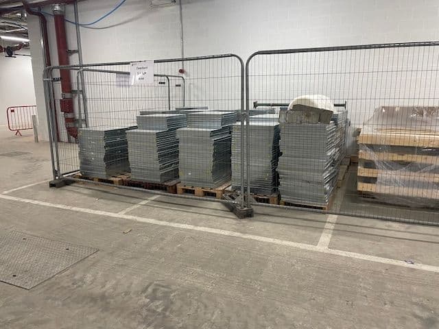 Raised access floor panels lifted and stacked on site