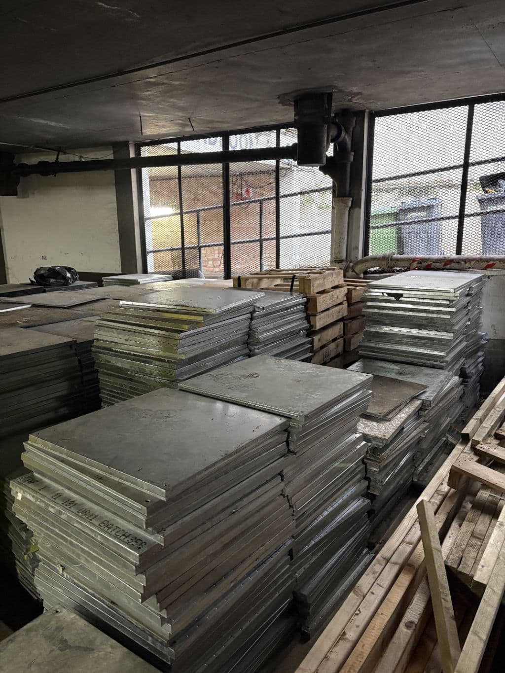 Aluminium raised access floor panels stacked on site